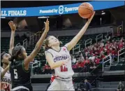  ?? BRYAN EVERSON — MEDIANEWS GROUP ?? Rochester Hills Lutheran Northwest sophomore Addie Troska attempts to finish with her left hand in Thursday afternoon’s Class 3girls basketball semifinal in East Lansing against Ypsilanti Arbor Prep. The Crusaders fell to the Gators, 52-30.