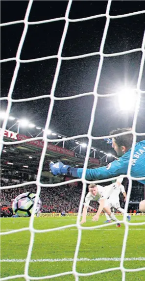  ??  ?? > Lukasz Fabianski saves from Josh King of Bournemout­h last time game ended in defeat for the Swans and there are still likely to be more twists in the battle to beat the drop