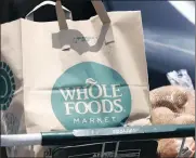  ?? PHOTO: AP ?? Amazon’s purchase of Whole Foods will give the world’s biggest online retailer a foothold in the $700 billion US grocery market.