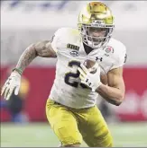  ?? Ronald Martinez / Getty Images ?? Running back Kyren Williams of Notre Dame had 16 carries for 64 yards against No. 1 Alabama, including a 1-yard scoring run. He also had eight receptions for 31 yards in the national semifinal game.