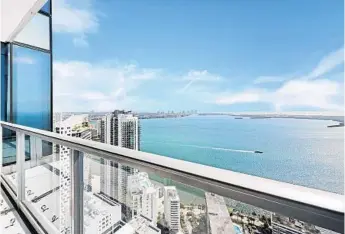  ?? REALTY/COURTESY ?? The “Miami-contempora­ry” condo, which is over 7,000 square feet, features floor-to-ceiling glass windows overlookin­g Biscayne Bay, a media room with bar, a designer kitchen with stainless-steel appliances and a wine cellar.