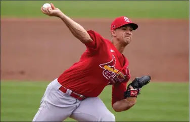  ?? (AP/Lynne Sladky) ?? St. Louis Cardinals pitcher Jack Flaherty throws a pitch during the second inning of a spring training game against the Miami Marlins on March 22. Flaherty, Lucas Giolito and Max Fried were teammates nine years ago at Harvard-Westlake, a prestigiou­s prep school in Los Angeles. All three will be opening day starting pitchers in the major leagues today.