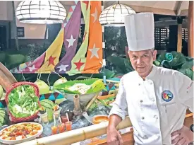  ??  ?? EXECUTIVE Chef Bienvenido Chavez whips up a seafood fiesta at La Parilla at Waterfront