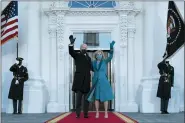  ?? ALEX BRANDON — THE ASSOCIATED PRESS ?? President Joe Biden and first lady Jill Biden wave as they arrive at the North Portico of the White House, Jan. 20.