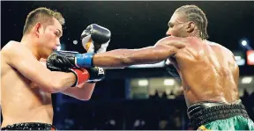  ?? FILE ?? Nicholas Walters (right) throws a jab against Nonito Donaire in the sixth round during a WBA featherwei­ght title fight on Saturday, October 18, 2014, in Carson, California.