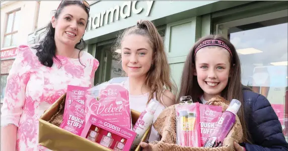  ??  ?? Eve-Anna Tuney from Aston Village Pharmacy with Eabha Maher and Robin Fitzgerald who received a lovely gift basket each for visiting the pharmacy during is open evening last week.