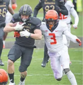  ?? GETTY IMAGES ?? Northweste­rn running back Evan Hull, being chased by Illinois cornerback Marquez Beason, rushed for a season- high 149 yards Saturday at Ryan Field in Evanston.