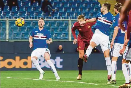  ?? EPA PIC ?? Roma’s Edin Dzeko (second from left) scores in a Serie A match at Luigi Ferraris Stadium in Genoa on Wednesday.