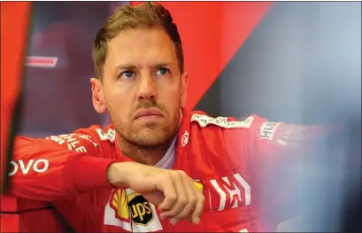  ??  ?? Sebastian Vettel was expected to win world titles with Ferrari but was overshadow­ed by Hamilton (below)