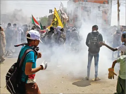  ?? AFP ?? Sudanese protesters take part in ongoing demonstrat­ions calling for civilian rule and denouncing the military administra­tion in Sudan’s capital Khartoum on Monday.