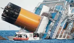  ?? Gregorio Borgia / Associated Press file photo ?? Italian firefighte­rs search the luxury cruise ship Costa Concordia that ran aground off the tiny Tuscan island of Isola del Giglio on Jan. 15, 2012, killing 32.