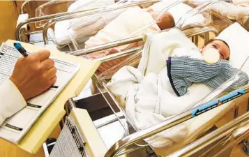  ?? SETH WENIG AP ?? U.S. births rebounded last year from the first pandemic year of 2020, but there were still about 86,000 fewer births in 2021 than in 2019, according to a government report released today.