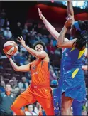  ?? SEAN D. ELLIOT/THE DAY ?? Connecticu­t Sun guard Layshia Clarendon puts up a shot over Dallas Wings defenders Theresa Plaisance and Kayla Thornton.