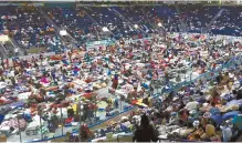  ?? AP-Yonhap ?? Evacuees fill Germain Arena, which is being used as a storm shelter, in advance of Hurricane Irma, in Estero, Fla., Saturday. Thousands of people in the Caribbean fought desperatel­y to find shelter, and more than 6 million people in Florida and Georgia...