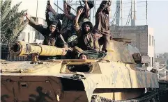  ?? RAQQA MEDIA CENTRE / THE ASSOCIATED PRESS FILES ?? Fighters from the Islamic State group ride tanks during a parade in Raqqa, Syria. Qasim Al-Muzaqzaq says he agreed to work for ISIL in Syria not out of a desire to fight, but because he was “suffering from a financial crisis.”