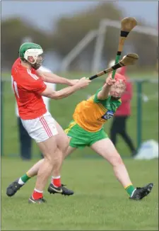  ??  ?? Shane Callan drives the ball forward for Louth.