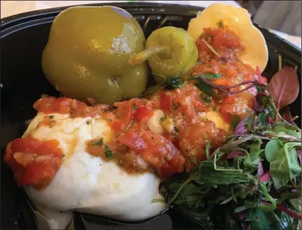  ?? (Arkansas Democrat-Gazette/Eric E. Harrison) ?? Ristorante Capeo makes its own fresh mozzarella for its Caprese appetizer.