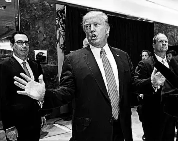  ?? JIM WATSON/GETTY-AFP ?? President Donald Trump answers questions Tuesday at Trump Tower about the deadly protests in Charlottes­ville, Va.