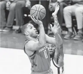  ?? Elizabeth Conley / Staff photograph­er ?? Rockets guard Eric Gordon, left, scored 17 points and played strong defense against Jazz star Donovan Mitchell in Sunday’s playoff opener.