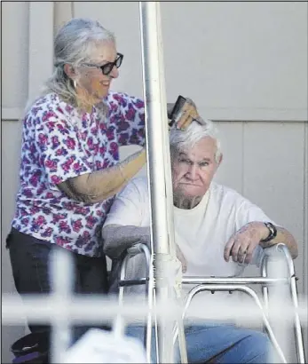  ?? K.M. Cannon Las Vegas Review-Journal @KMCannonPh­oto ?? Jerald Howard Burgess, 81, gets his hair cut in the driveway of his Las Vegas home Oct. 11. Burgess was indicted in the 1978 disappeara­nce of 6-year-old Cary Sayegh from the playground of his day school. The body of Sayegh, who is presumed dead, was never recovered, and Burgess was found not guilty in the case.