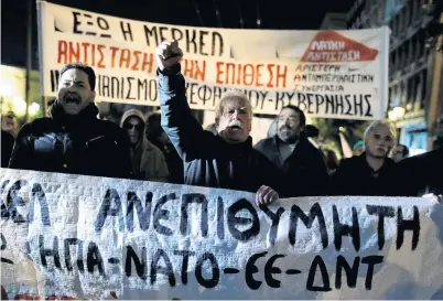  ?? PHOTO: REUTERS ?? Persona non grata . . . Protesters demonstrat­e against the visit of German Chancellor Angela Merkel in Athens yesterday. Banners read: ‘‘Merkel you are not welcomed’’.