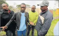  ?? Picture: BRIAN WITBOOI ?? NO EASY ANSWERS: Lucky Kaliati, centre, speaks on behalf of the street vendors whose merchandis­e was confiscate­d at the weekend