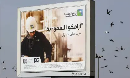  ?? Photograph: Amr Nabil/AP ?? A billboard advertisem­ent in Jiddah, Saudi Arabia, reads: ‘Saudi Aramco, soon on stock exchange.’