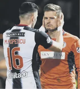  ??  ?? St Mirren goalkeeper Vaclav Hladky was dazed after a flashbang exploded next to him during Wednesday’s match against Celtic.