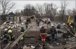  ?? ROMAN HRYTSYNA — THE ASSOCIATED PRESS ?? Emergency workers remove debris of a house destroyed following a Russian missile strike in Kyiv, Ukraine, on Thursday.