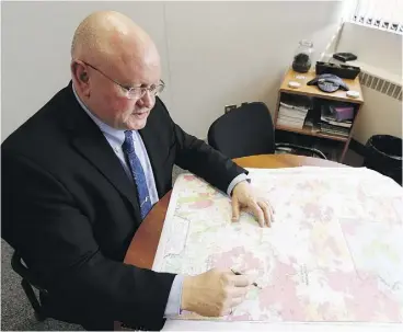  ?? IAN KUCERAK ?? Bernie Schmitte, wildfire manager with Fort McMurray Wildfire Management Area, pictured in his office in April, knew Fire 9 was going to be a problem when he saw how hot it burned late into the night.