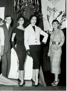  ??  ?? 1 Karl Lagerfeld (far left) and Yves Saint Laurent, then 18, pose with models after winning the coat and dress prizes, respective­ly, at the Internatio­nal Wool Secretaria­t in Paris, 1954