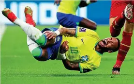  ?? REUTERS ?? Rough and tumble: Neymar is felled on a bruising night