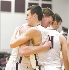  ?? Bud Sullins/Special to Siloam Sunday ?? Siloam Springs senior basketball players Harrison Kretzer, left, and Charlie Jones embrace after exiting Friday’s game for the final time in the Panthers’ 66-49 win over Russellvil­le on Senior Night at the Panther Activity Center.