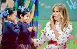  ?? — PTI ?? US First Lady Melania Trump interacts with school children during her visit to a government school to witness various activities as part of the happiness curriculum in New Delhi on Tuesday.
