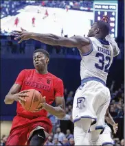  ?? DAVID JABLONSKI / STAFF ?? Kostas Antetokoun­mpo (left) scored eight points, had four rebounds and blocked two shots in Dayton’s 81-56 loss at Rhode Island on Friday.