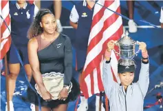  ?? AFP photo ?? Naomi Osaka (right) of Japan and Serena Williams of the United States pose with their trophies after their Women’s Singles finals match on Day Thirteen of the 2018 US Open at the USTA Billie Jean King National Tennis Center in the Flushing neighborho­od of the Queens borough of New York City. —