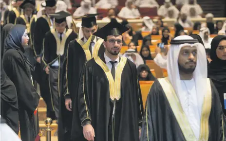  ?? Leslie Pableo for The National ?? Hundreds of Khalifa University students attend a graduation ceremony at Emirates Palace hotel yesterday