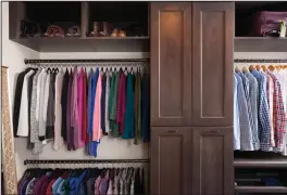  ?? Dana Hoff/Marnie Homes via AP ?? This photo provided by Case Design shows a closet designed by Elena Eskandari, an interior designer specialist at Case Design. As you plan out a walk-in closet, consider the size of the items you’ll be hanging. This closet pictured has two levels of hanging space which offers room for a large collection of shirts and blouses.