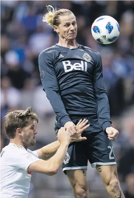  ?? — THE CANADIAN PRESS ?? Vancouver’s Brek Shea gets his head on the ball in front of the goal but fails to score as Los Angeles FC’s Walker Zimmerman defends during Friday’s game at B.C. Place.