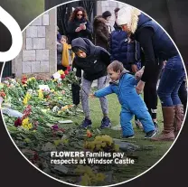  ??  ?? FLOWERS Families pay respects at Windsor Castle