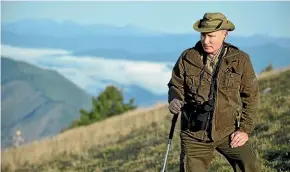  ?? AP ?? Russian President Vladimir Putin rests during a holiday in the Siberian Tyva region. Footage from the trip featured on a new weekly TV show about the president.