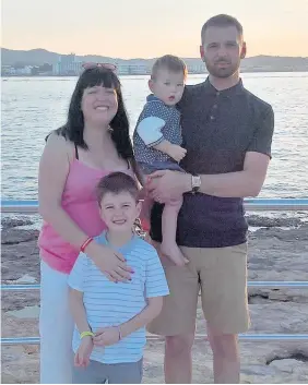  ??  ?? > James and Lisa Scott with son Mitchell, seven, and Noah, now two