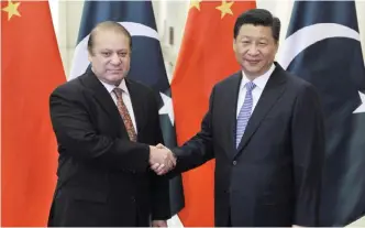  ??  ?? BEIJING: In this file-pool photo, Pakistani Prime Minister Nawaz Sharif (left) and Chinese President Xi Jinping shake hands before their meeting at the Great Hall of the People in Beijing, China. Pakistani leaders often wax lyrical about their ‘sweeter...