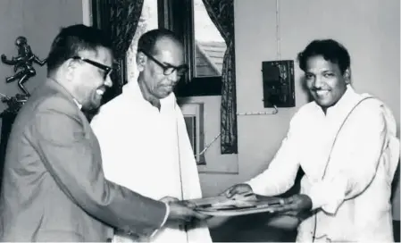  ??  ?? JUNE 1970: A.N. Sattanatha­n handing over the report of the First Tamil Nadu Backward Classes Commission to Chief Minister M. Karunanidh­i in the presence of Minister of Labour and Backward Classes N.V. Natarajan.