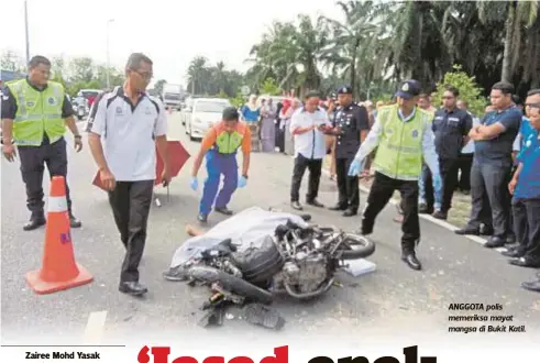  ??  ?? ANGGOTA polis memeriksa mayat mangsa di Bukit Katil.