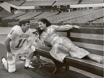  ?? Houston Chronicle file photo ?? Loyalty to fashion staples has run for decades, show here in a 1969 ad featuring Anita Martini in the dressiest pantsuit possible from Palais Royal’s Oscar de la Renta boutique.