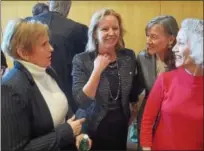  ?? PETE BANNAN — DIGITAL FIRST MEDIA ?? Newly elected Chester County row officers, from left: Treasurer Patricia Maisano, Controller Margaret Reif, Clerk of Courts Yolanda Van de Krol and Coroner Dr. Christina VanePol converse following their swearing-in ceremonies.