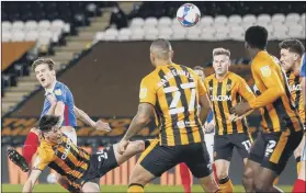  ??  ?? Pompey rise to the League One summit after previous pacesetter­s Hull twice put through their own net. reports...
EARLY OPENER Hull’s Jacob Greaves diverts the ball past his own goalkeeper while challenged by Sean Raggett, giving Pompey a fifth-minute lead