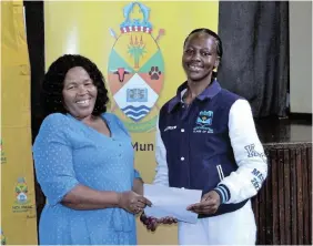  ?? ?? BIG OPPORTUNIT­Y: Alwaba Mxuma receives her letter confirming her registrati­on funding bursary from Ndlambe mayor Khululwa Ncamiso at the Civic Centre on Thursday February 1.
