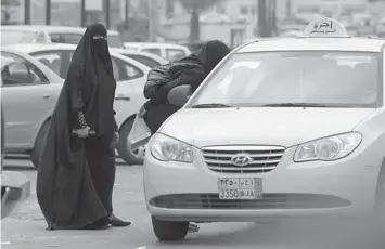 ??  ?? In this 2011 photo, Saudi women board a taxi in Riyadh, Saudi Arabia.